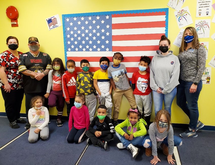 Cooke School students helped to measure and create this flag bulletin board. Recently they learned about serving in the military.